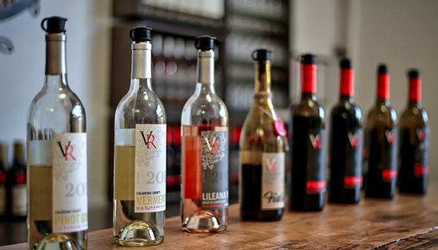 Via Romano Vineyards wine bottles lined up